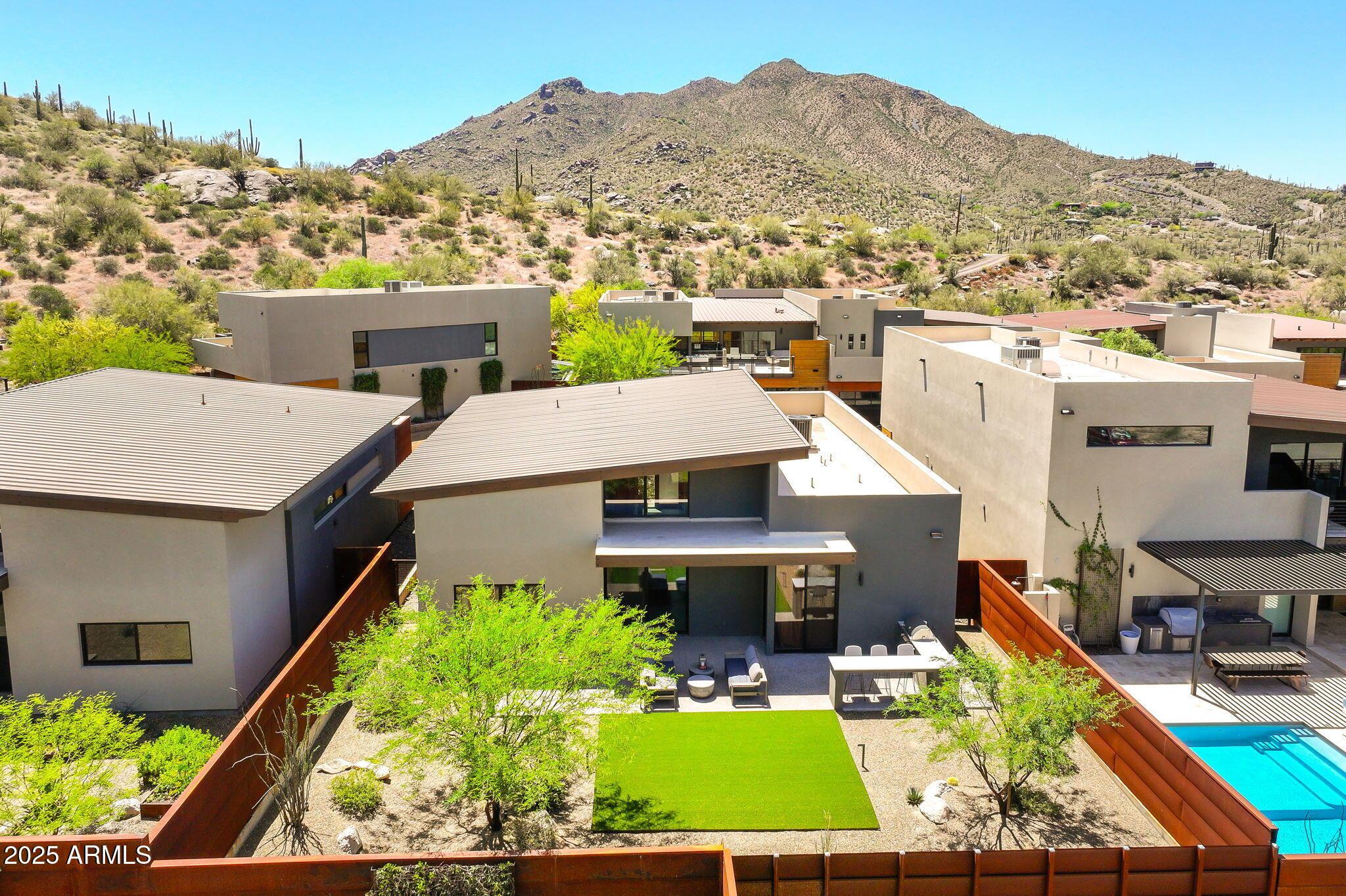 6525 East Cave Creek Road, Unit 31 Cave Creek, AZ 85331 - Photo 46 of 49 an aerial view of a house with a garden and lake view