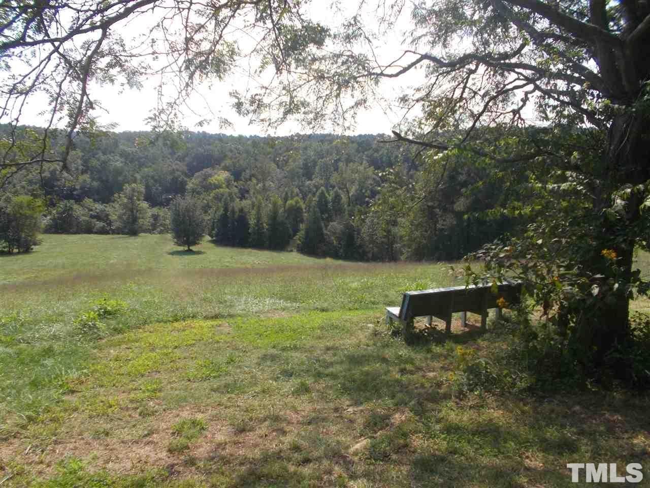 a view of a bench in a field