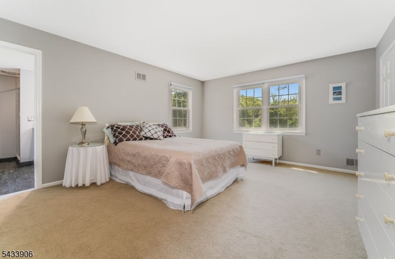 14 Lexington Road Annandale, NJ 08801 - Photo 25 of 47 a bedroom with a bed and a window