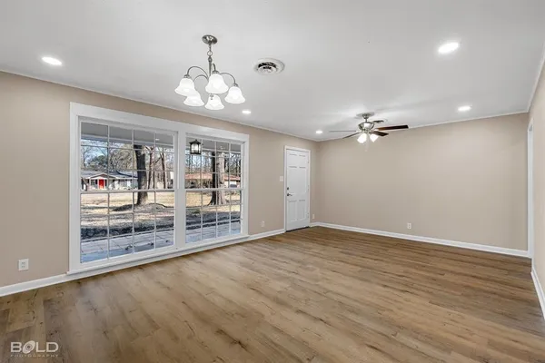a view of an empty room with a window