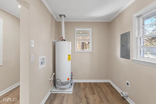 a view of small space with wooden floor and windows