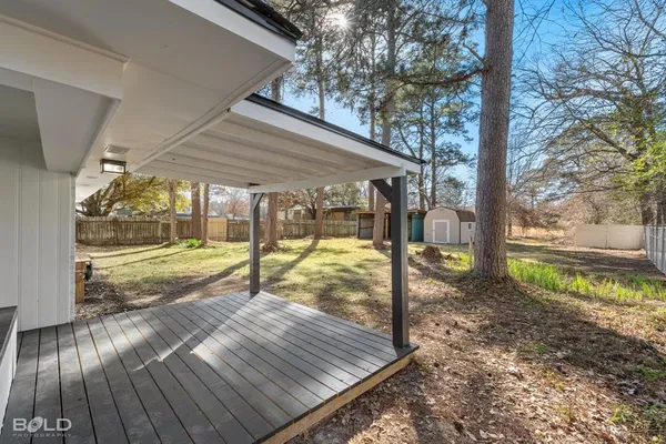 a view of yard with wooden floor