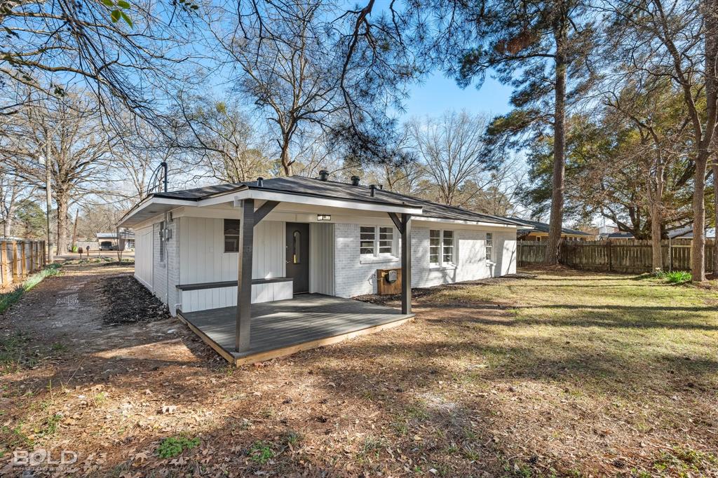 1211 Lee Street Benton, LA 71006 - Photo 28 of 39 a white house that has a tree in front of it