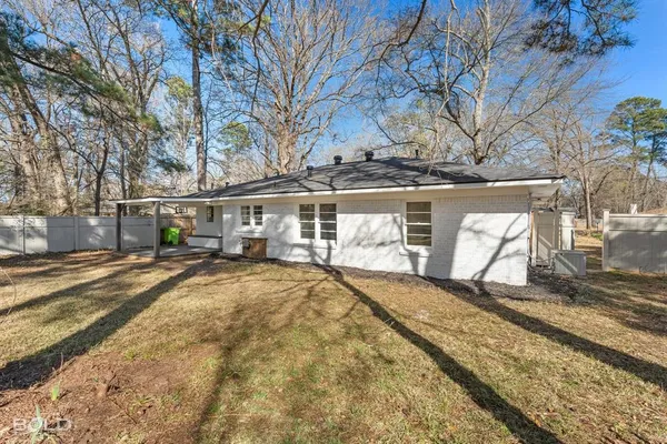 a view of house with trees in the background
