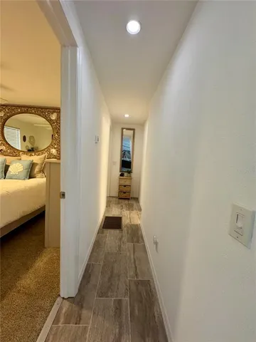 a bed room with furniture and a flat screen tv