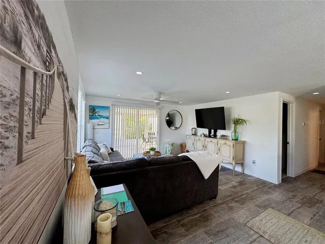 a kitchen with a refrigerator a stove and a sink