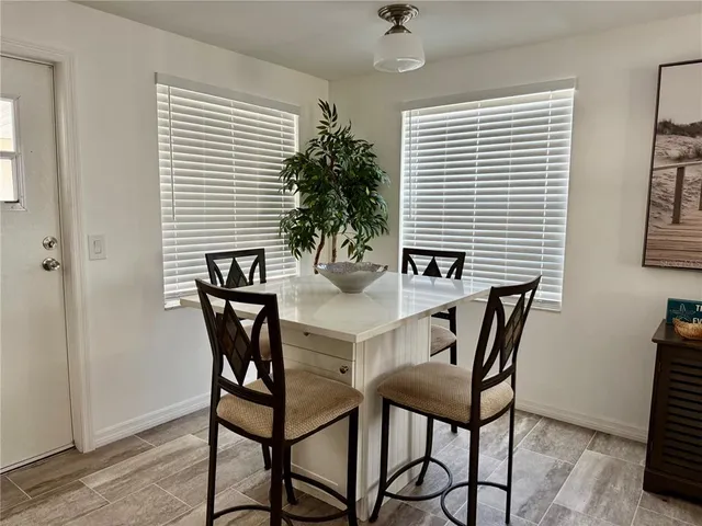 a sitting area with furniture and a garden