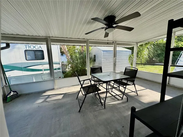 a view of a backyard with plants and a patio