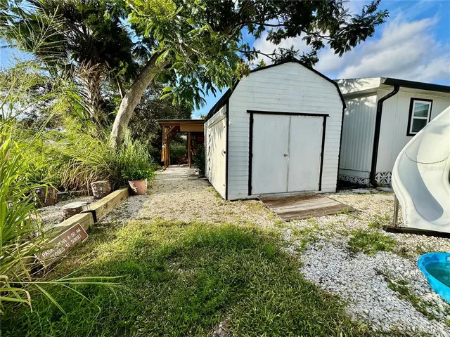 a view of a dining room with furniture and window