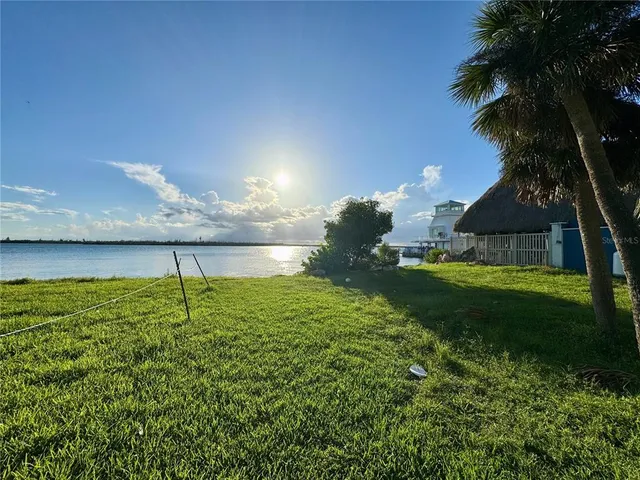 a bedroom with a bed and a mirror