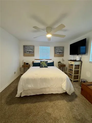a bathroom with a sink mirror and toilet