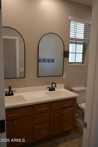 a bathroom with a shower and a toilet