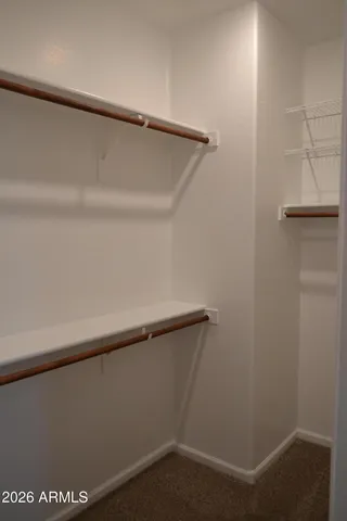 a bathroom with double vanity sinks and a mirror
