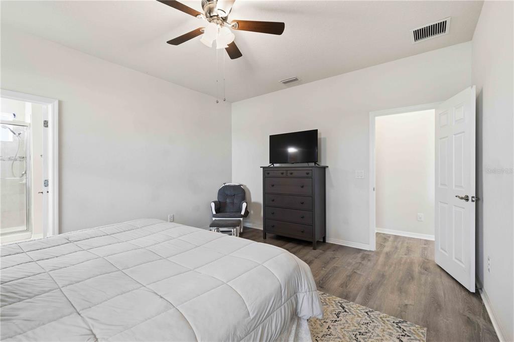 10920 79th Street East Parrish, FL 34219 - Photo 33 of 73 a bedroom with a bed and a television
