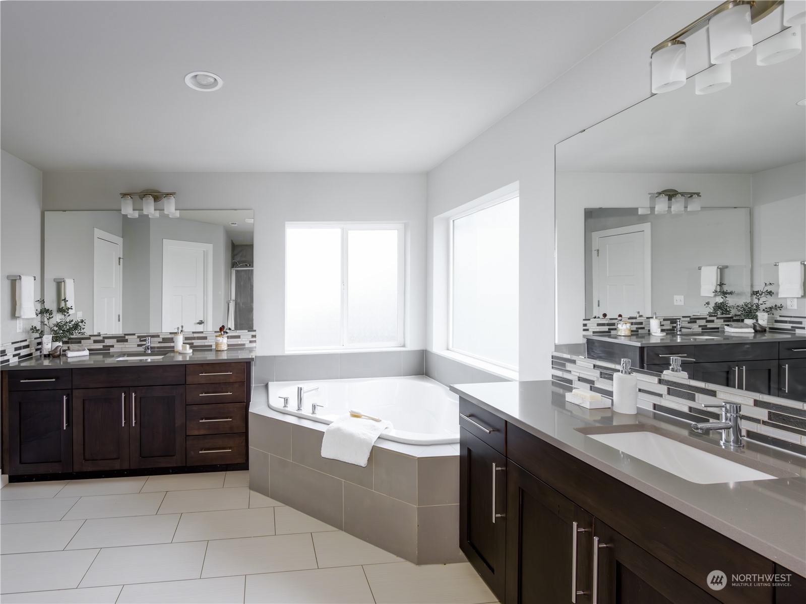 21502 44th Drive Southeast Bothell, WA 98021 - Photo 17 of 35 a bathroom with a granite countertop double vanity sink and a bathtub