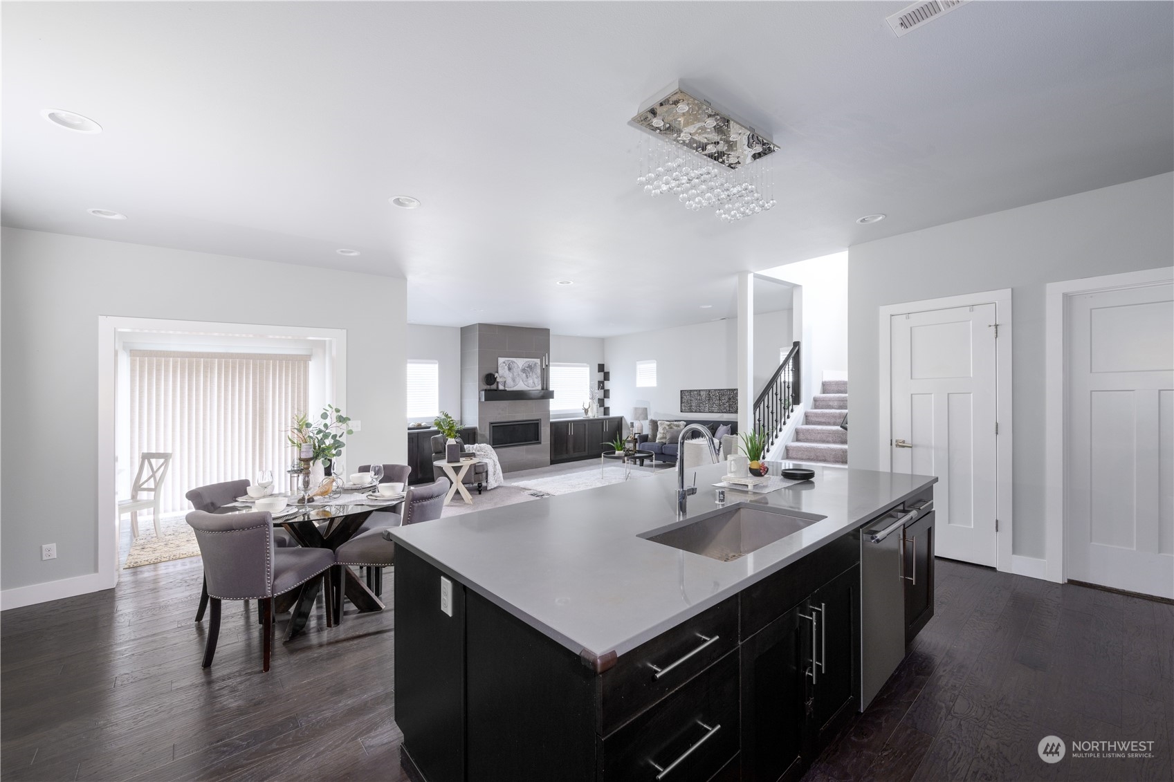 21502 44th Drive Southeast Bothell, WA 98021 - Photo 10 of 35 a kitchen with a dining table chairs and white cabinets