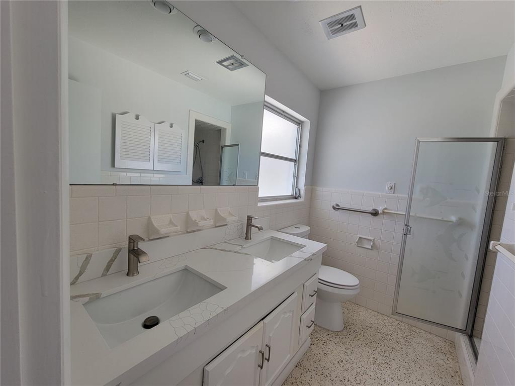 1732 Boca Raton Court Punta Gorda, FL 33950 - Photo 48 of 64 a bathroom with a sink toilet and shower