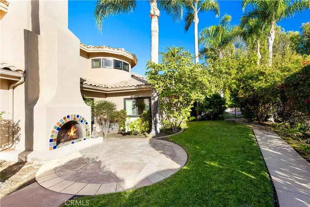 a living room with fireplace furniture and a fireplace