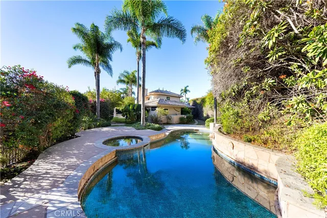 a bathroom with a double vanity sink mirror and shower