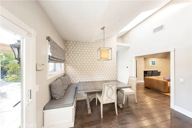 a spacious bedroom with a bed and a couch