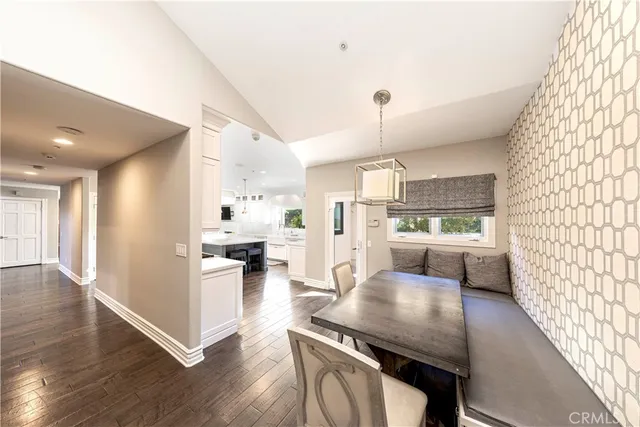 a view of a livingroom with furniture window and wooden floor