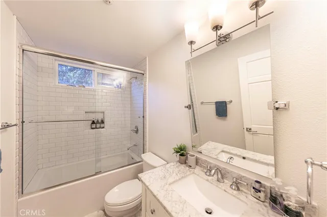 a living room with fireplace furniture and a flat screen tv