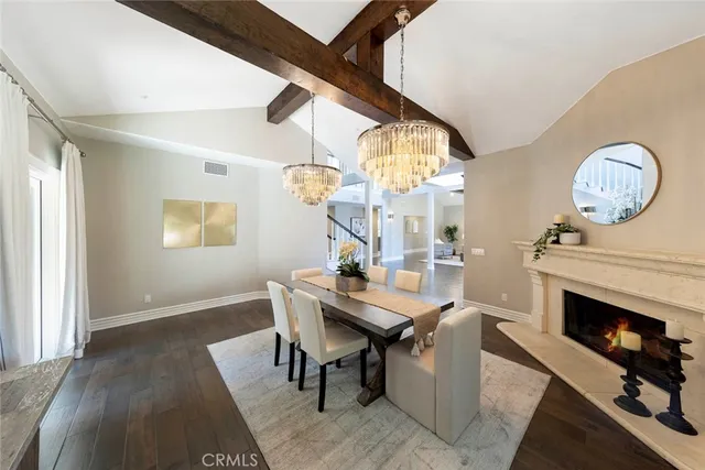 a bathroom with a sink a toilet a shower and a mirror