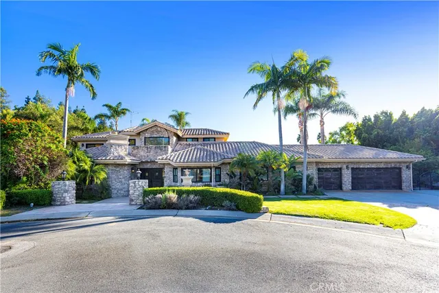 a view of backyard with swimming pool and outdoor seating