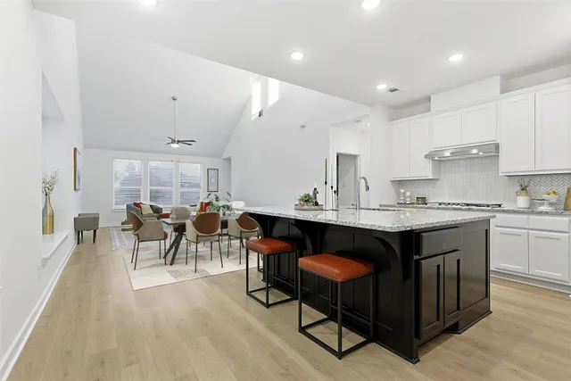 a kitchen with sink and cabinets