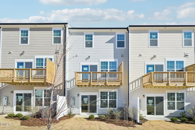 a front view of a building with a yard