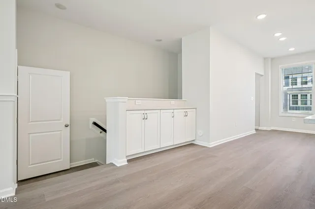 an empty room with wooden floor