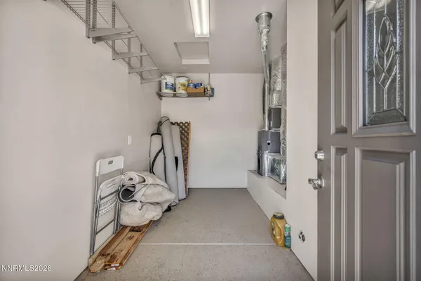 a view of storage and utility room with two windows