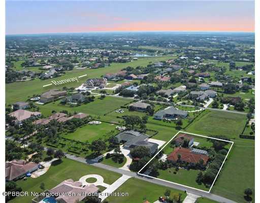 an aerial view of a house with a garden