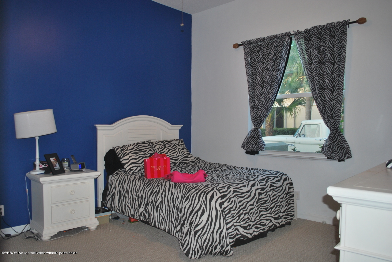 15920 Weatherly Road Wellington, FL 33414 - Photo 11 of 13 a bedroom with a bed and a couch