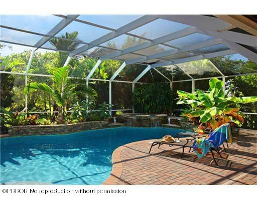 15920 Weatherly Road Wellington, FL 33414 - Photo 4 of 13 a view of a chairs and table in the garden