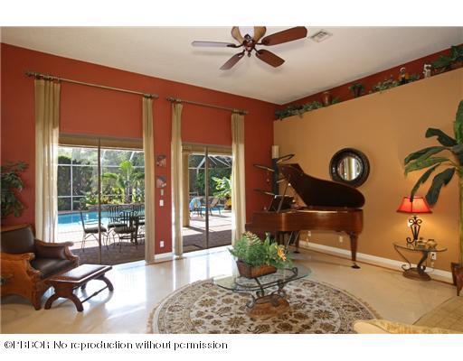 15920 Weatherly Road Wellington, FL 33414 - Photo 6 of 13 a living room with furniture and a large window