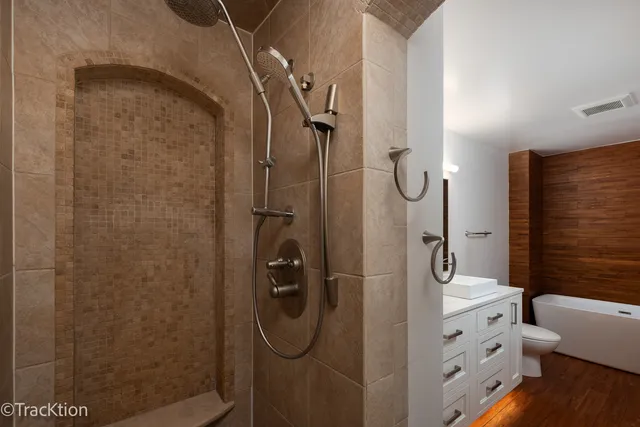 a bathroom with a granite countertop shower
