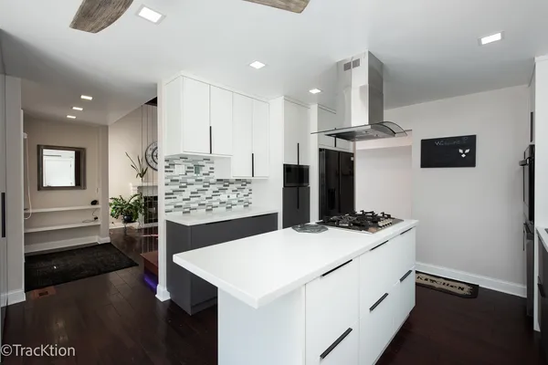 a kitchen with a stove and a refrigerator