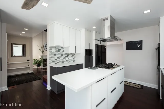 a kitchen with a stove and a refrigerator
