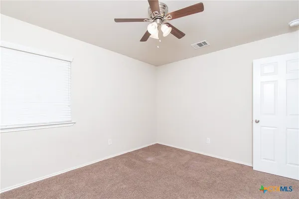 a view of a big room with carpet