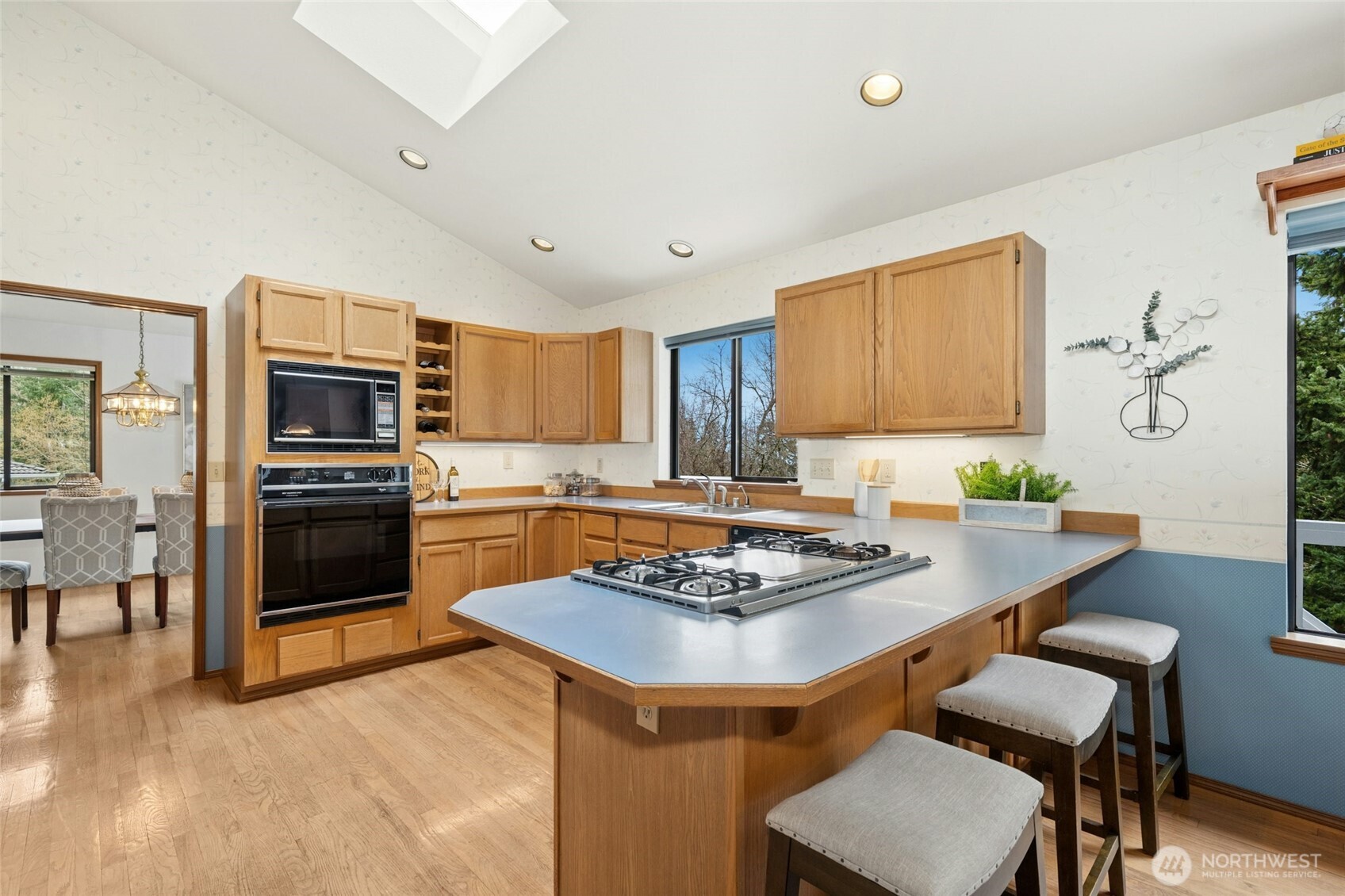2420 Squak Mountain Loop Southwest Issaquah, WA 98027 - Photo 11 of 40 a kitchen with a table and chairs in it
