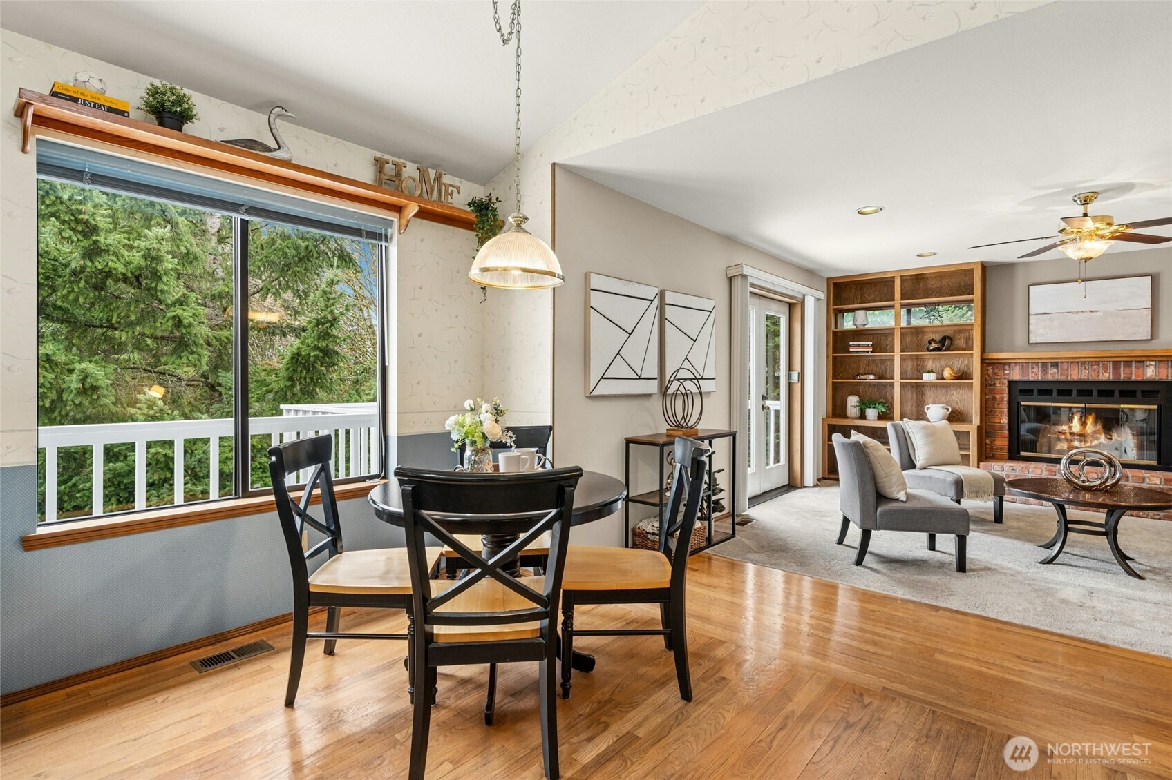 2420 Squak Mountain Loop Southwest Issaquah, WA 98027 - Photo 14 of 40 a dining room with furniture garden view and wooden floor