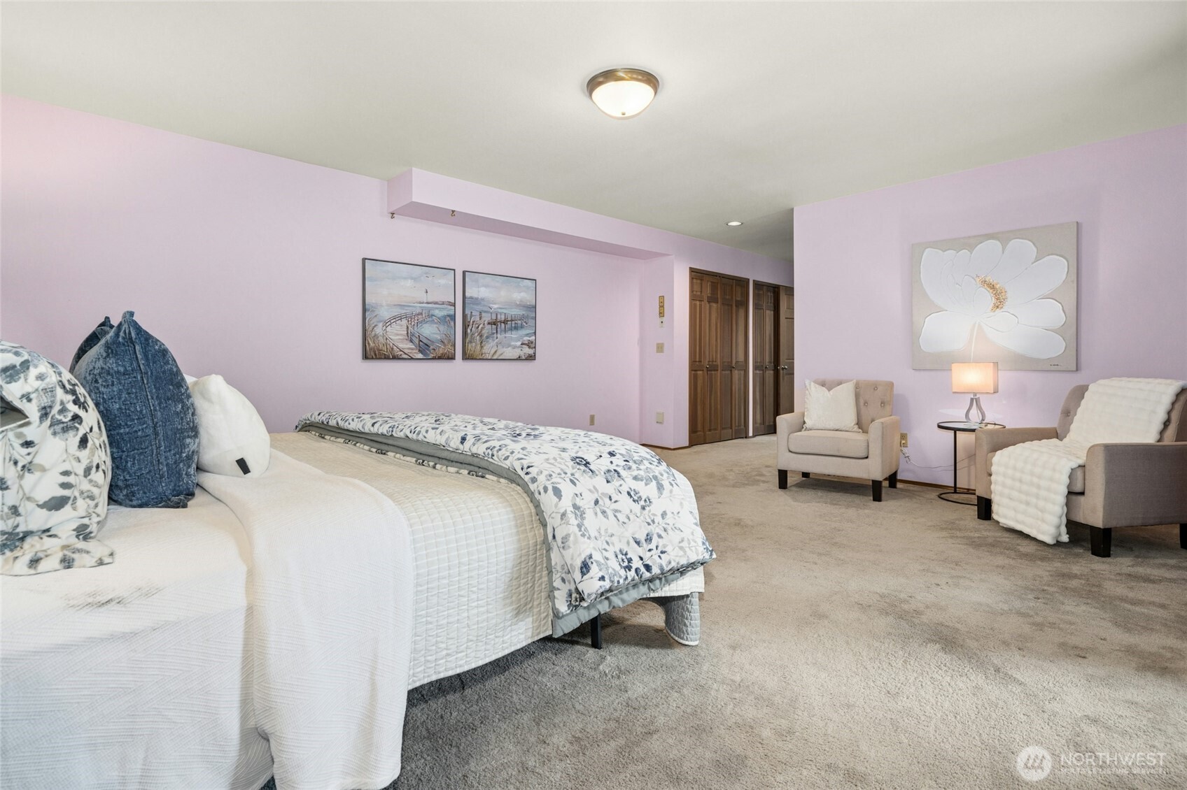 2420 Squak Mountain Loop Southwest Issaquah, WA 98027 - Photo 20 of 40 a spacious bedroom with a bed and a couch