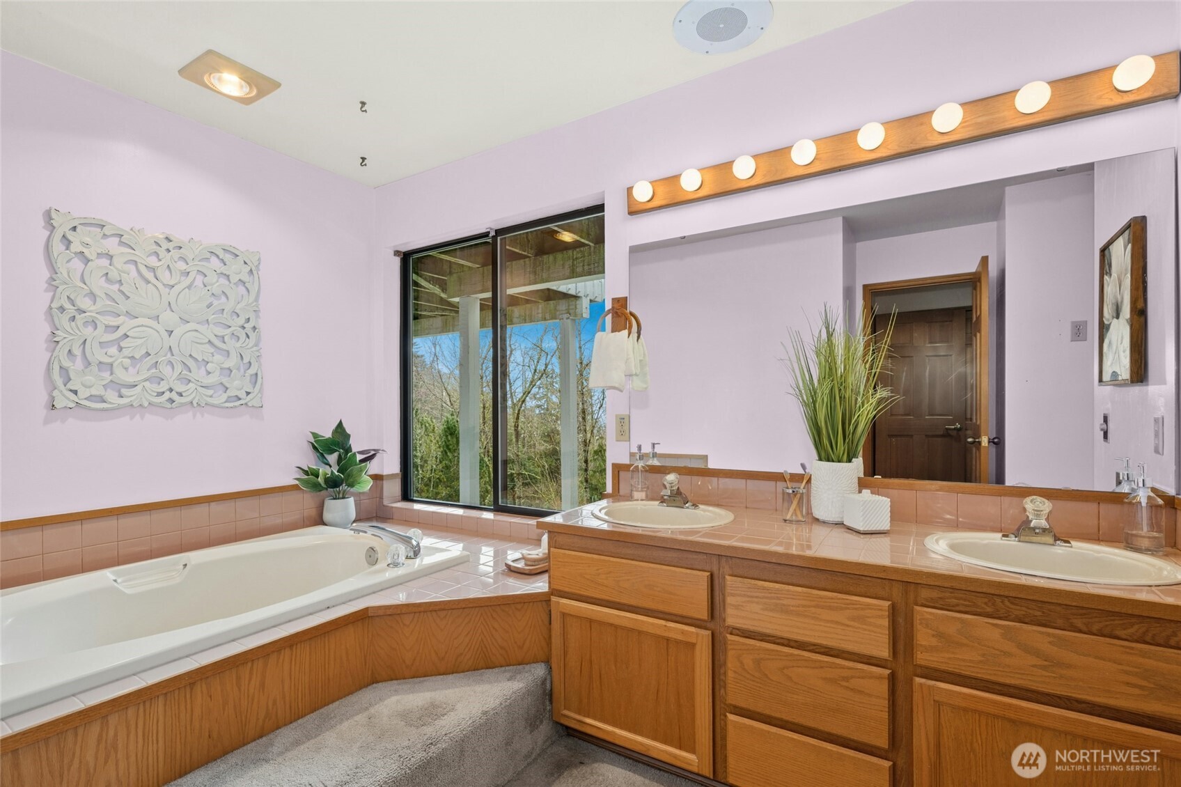 2420 Squak Mountain Loop Southwest Issaquah, WA 98027 - Photo 21 of 40 a bathroom with a granite countertop tub sink and mirror