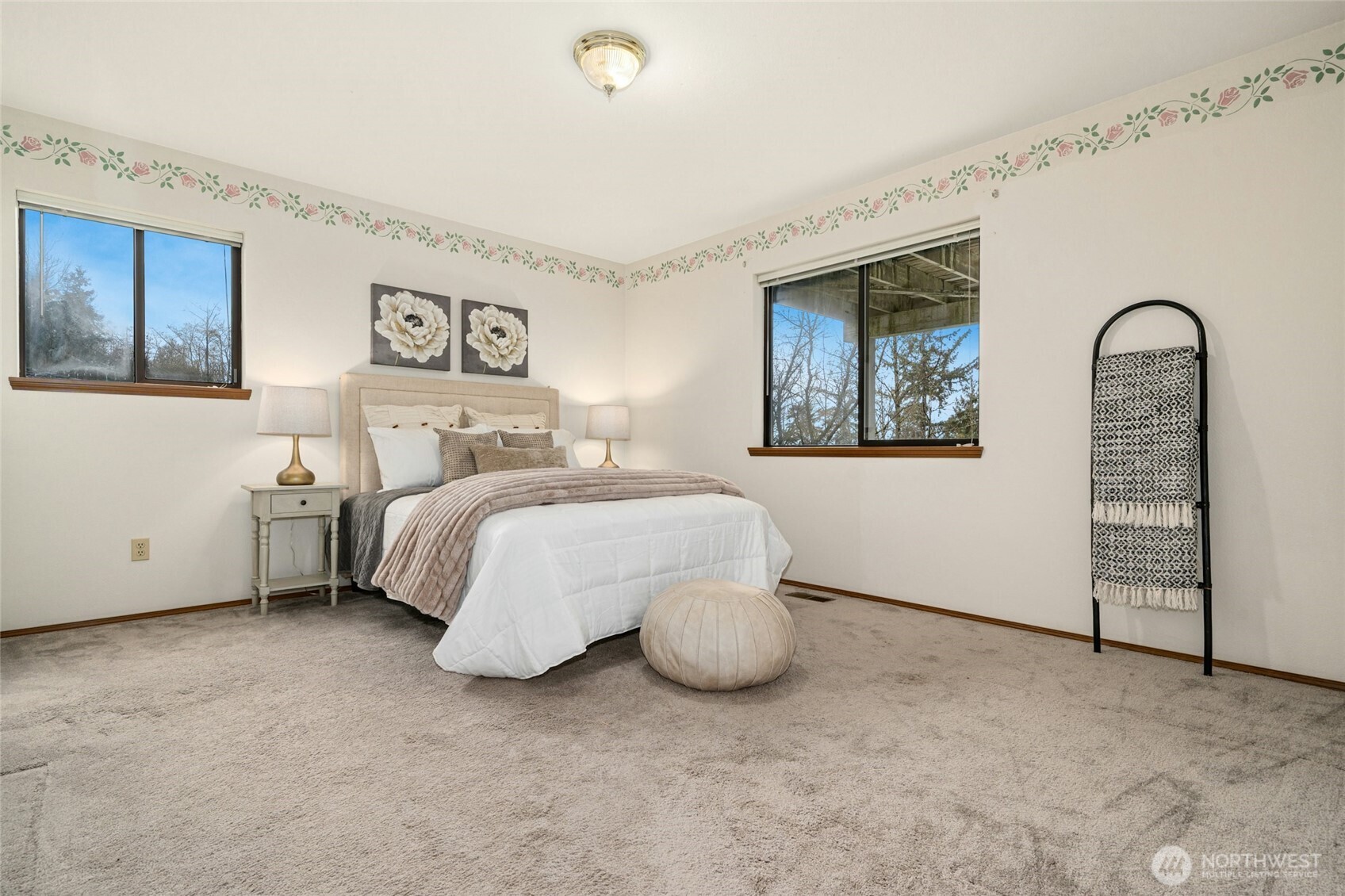 2420 Squak Mountain Loop Southwest Issaquah, WA 98027 - Photo 23 of 40 a bedroom with a bed and a painting on the wall