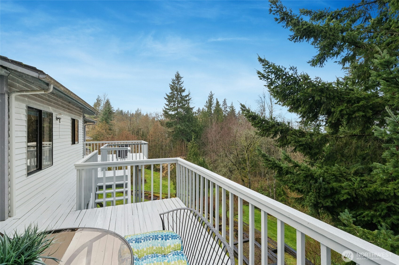 2420 Squak Mountain Loop Southwest Issaquah, WA 98027 - Photo 31 of 40 a view of a balcony with wooden floor and fence