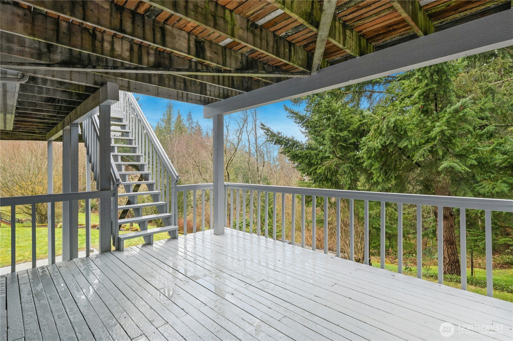 2420 Squak Mountain Loop Southwest Issaquah, WA 98027 - Photo 32 of 40 a view of deck with wooden floor and outdoor space