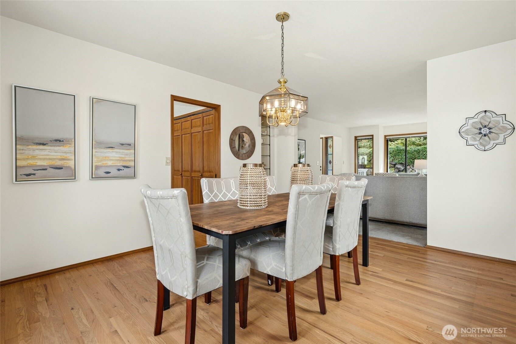 2420 Squak Mountain Loop Southwest Issaquah, WA 98027 - Photo 7 of 40 a view of a dining room with furniture wooden floor and a chandelier