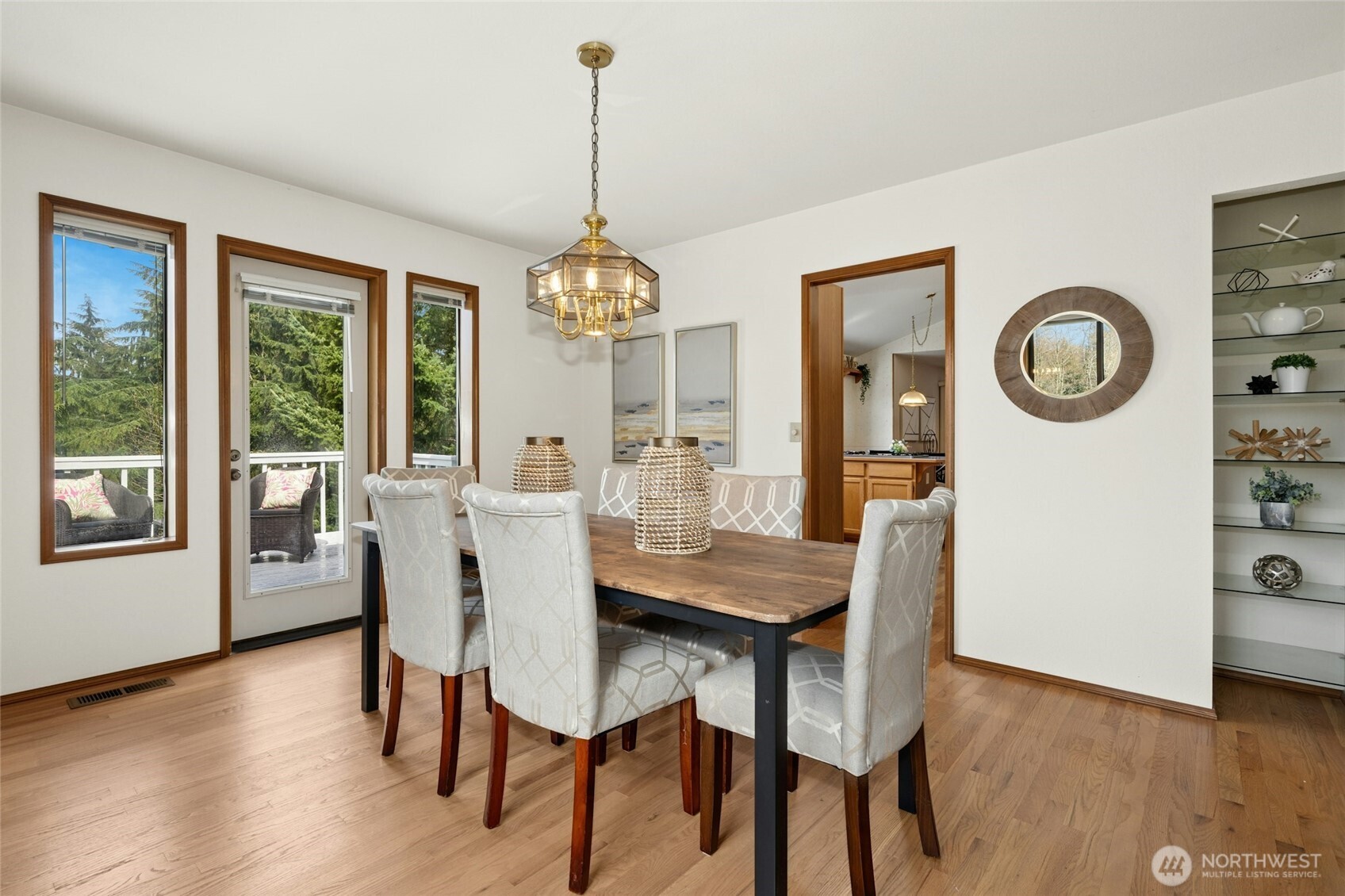 2420 Squak Mountain Loop Southwest Issaquah, WA 98027 - Photo 8 of 40 a view of a dining room with furniture window and wooden floor