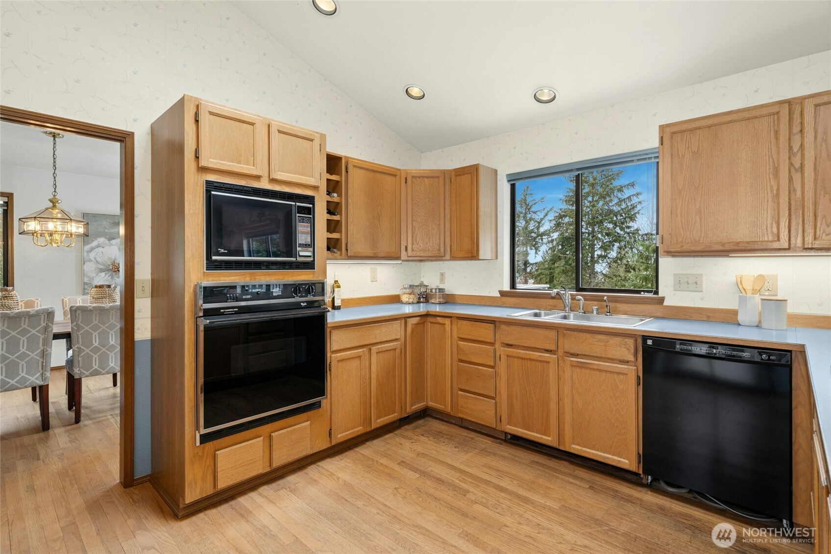 2420 Squak Mountain Loop Southwest Issaquah, WA 98027 - Photo 10 of 40 a kitchen with a sink stove and microwave